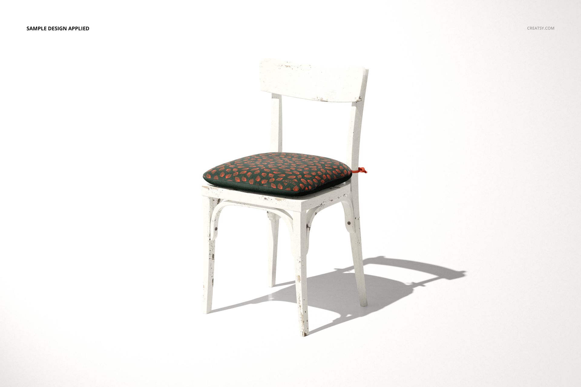 Single white wooden chair with a dark cushion featuring an orange pattern, shown in a PSD mockup on a neutral backdrop.