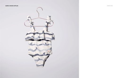 Front view of a striped baby swimsuit mockup with ruffle detail, displayed on a hanger over a plain white surface.