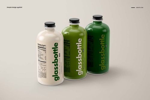 PSD mockup showing three glass bottles with varying label colors and visible nutritional information, arranged on a plain surface.