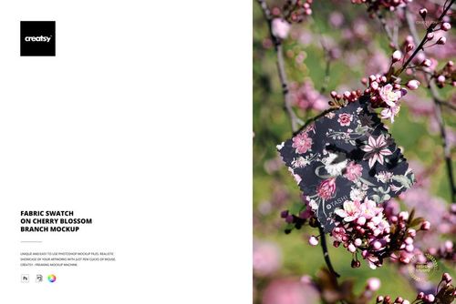 PSD mockup showing a fabric sample featuring a floral design placed among vibrant cherry blossom flowers.