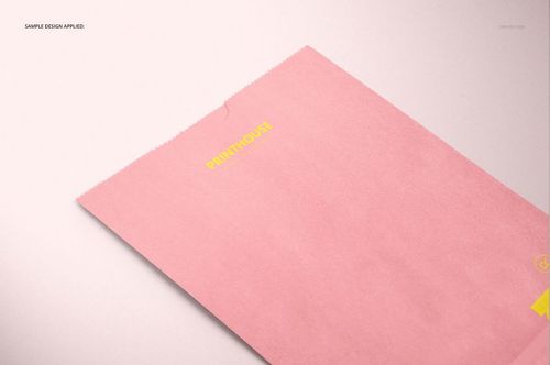 PSD mockup of a rectangular lunch bag in pastel pink, featuring yellow printed details, shown from a top angle.