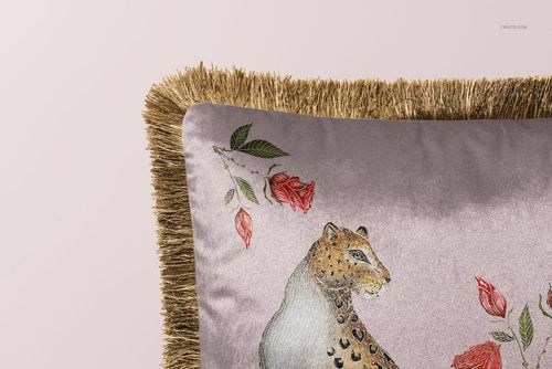 Fringed velvet pillow mockup with illustrated leopard and red rose design, shown in close-up front view.