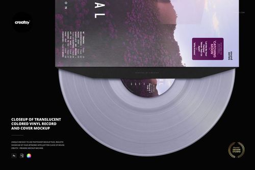 Close-up view of a translucent colored vinyl record partially tucked under a printed cover, set on a black background.