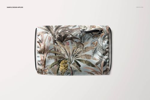 Silk face mask mockup displayed flat, showing intricate foliage and animal illustrations in soft brown and gray shades.