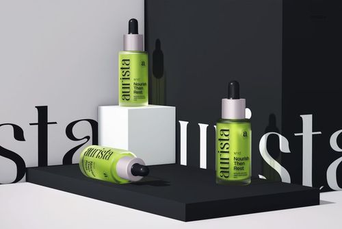 PSD mockup featuring green dropper bottles with black tops, styled on minimalist white and black stands.