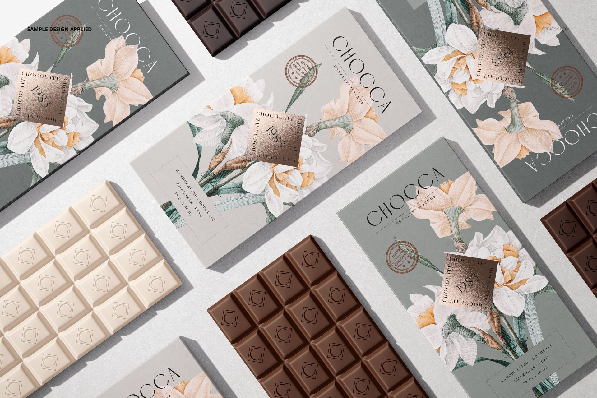 Assorted chocolate bar packaging mockups displayed in a top view, featuring milk, dark, and white chocolate bars with floral wrappers.