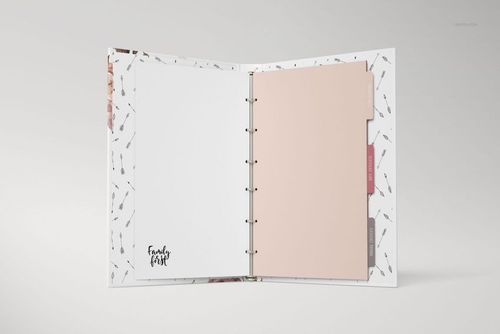 Open family book mockup with ring binding, showing blank white page and pastel divider tabs on a light background.
