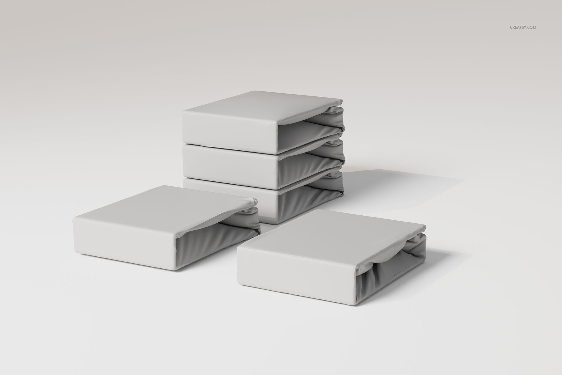 Stacked fitted bedsheet sets in light gray color, displayed on a plain surface with a soft shadow, front angle view.