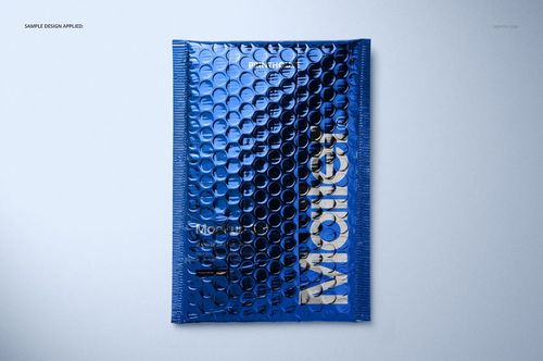Top view of a blue metallic bubble mailer mockup with embossed bubble texture and bold silver lettering.