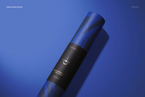 Yoga mat mockup featuring a rolled mat with blue wavy patterns and a black label, placed on a blue background.