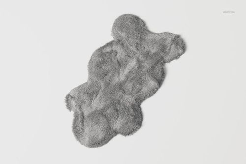 Gray faux sheepskin rug with a soft, fluffy texture shown from a top view on a plain white background.