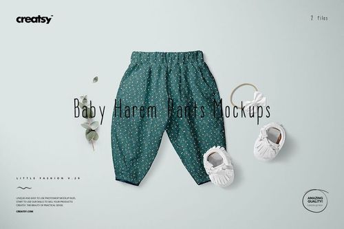 PSD mockup of baby harem pants in green with tiny white flowers, shown alongside baby shoes and a sprig of greenery.