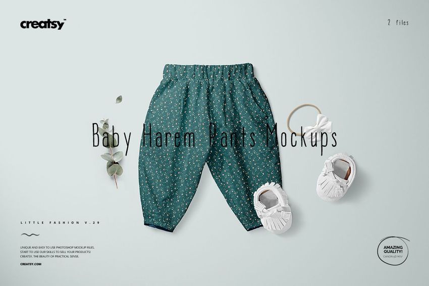 PSD mockup of baby harem pants in green with tiny white flowers, shown alongside baby shoes and a sprig of greenery.