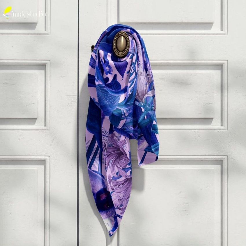 Silk scarf mockup featuring a purple and blue patterned scarf tied around a brass door handle on a white paneled door.