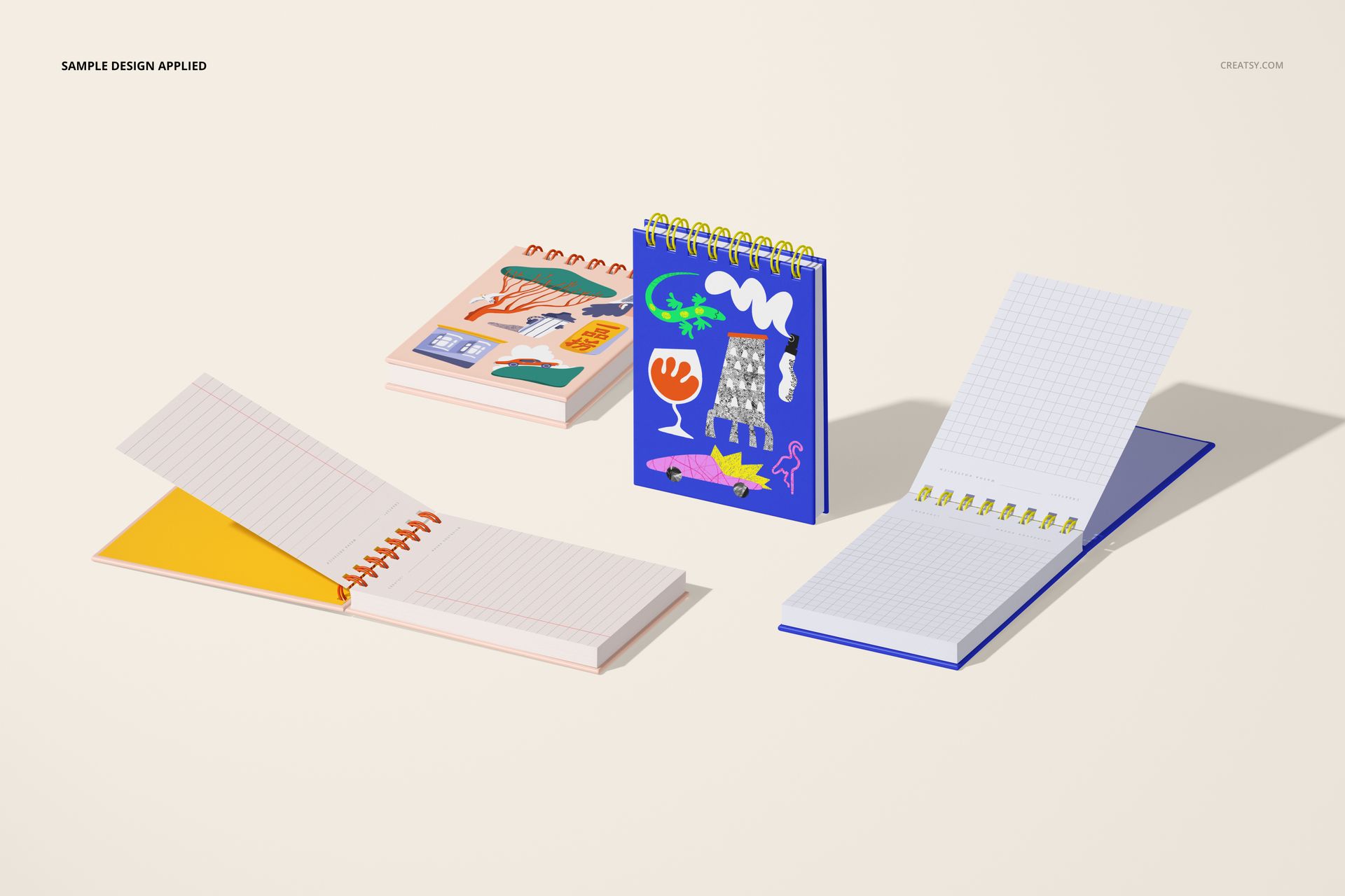 Spiral ring flip top notebook mockup set with vibrant illustrated covers and exposed grid paper, shown from above.