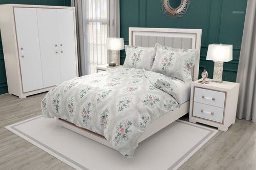 PSD mockup of a bedroom interior with a bed, flanged pillows, floral duvet cover, and matching decor elements.