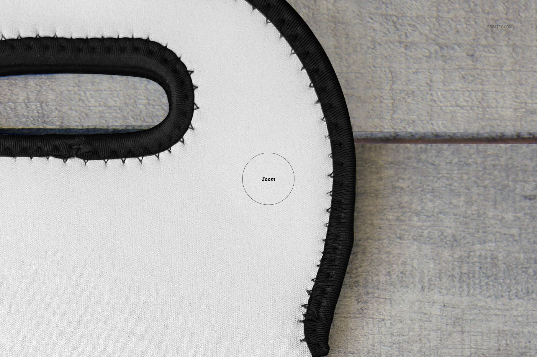 Detailed section of a wine bag mockup showing black trim and handle against a textured gray wood background.