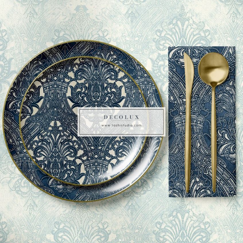 Placemat napkin plate mockup featuring a blue and white ornate pattern with gold cutlery on a textured background.