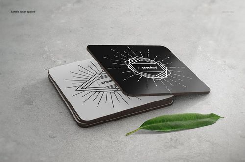 Rectangular coasters mockup set featuring black and white coasters with line art patterns, viewed from an angled perspective.