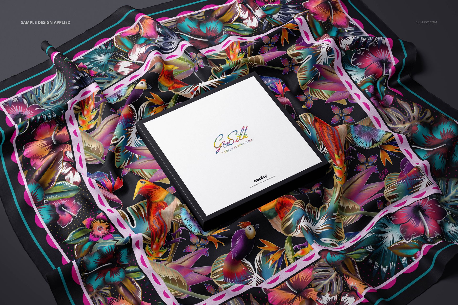 Colorful lightweight cashmere scarf featuring exotic birds and flowers, arranged around a branded box in a PSD mockup.