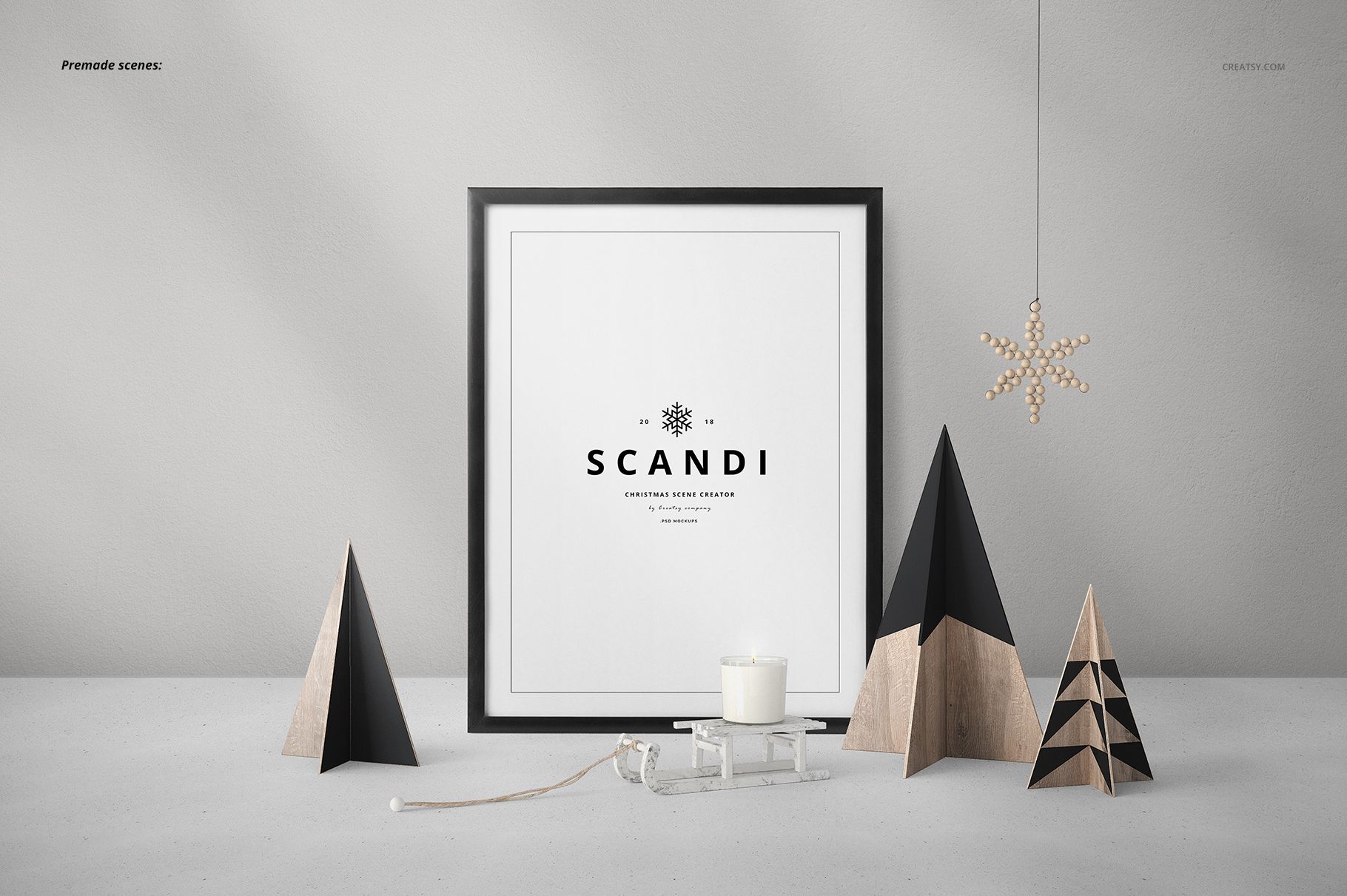 Scandi-style Christmas mockup featuring geometric trees, a framed print, candle, and hanging snowflake decoration.