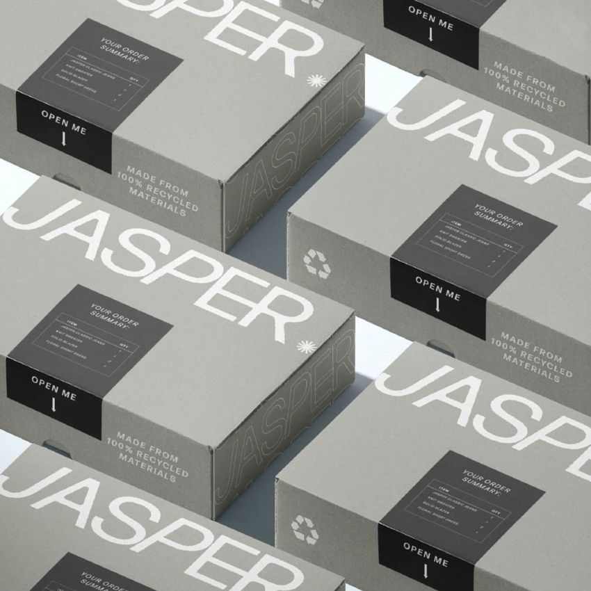 Sticker mockup showing several gray packaging boxes with white text, dark labels, and a minimal, modern design.