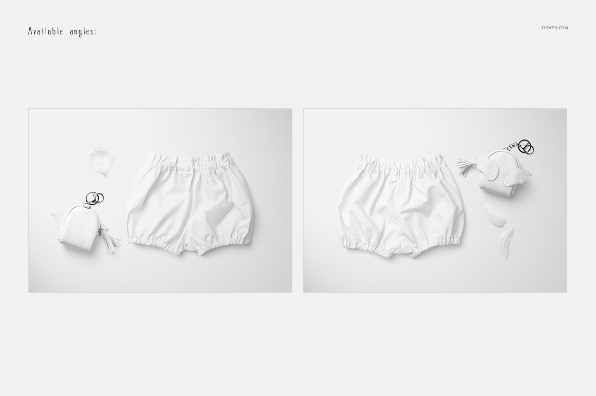 Two white baby harem shorts displayed on a flat surface with soft props, shown from top view in a mockup set.