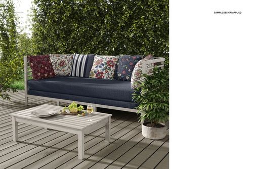Front view of a mockup showing a modern outdoor sofa with patterned pillows and a low wooden table on a patio.
