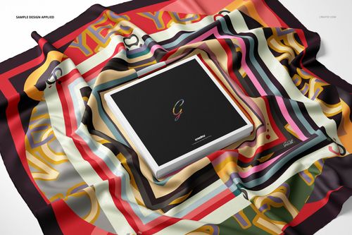 Twill silk scarf mockup featuring multicolored stripes and abstract shapes, arranged around a square gift box.