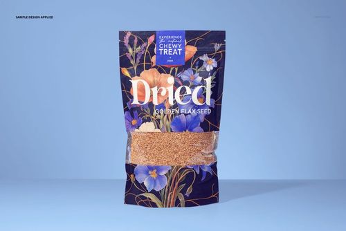 Front view of a paper pouch mockup filled with golden flax seeds, featuring a floral design on a light blue background.