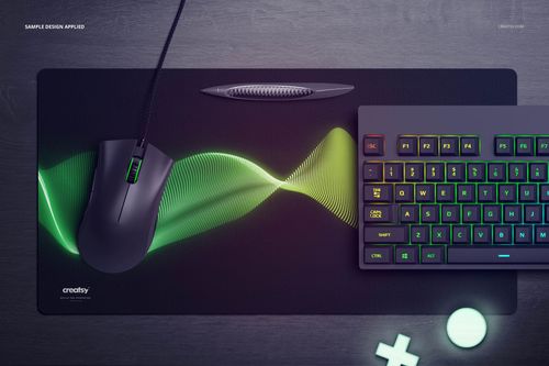 Rectangular gaming mouse pad mockup with green wave design, viewed from above with mouse and RGB keyboard.