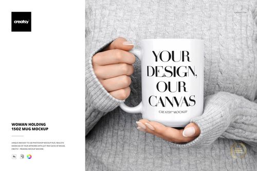 Woman wearing a light gray sweater holding a white 15oz mug with bold black text, front view, PSD mockup scene.