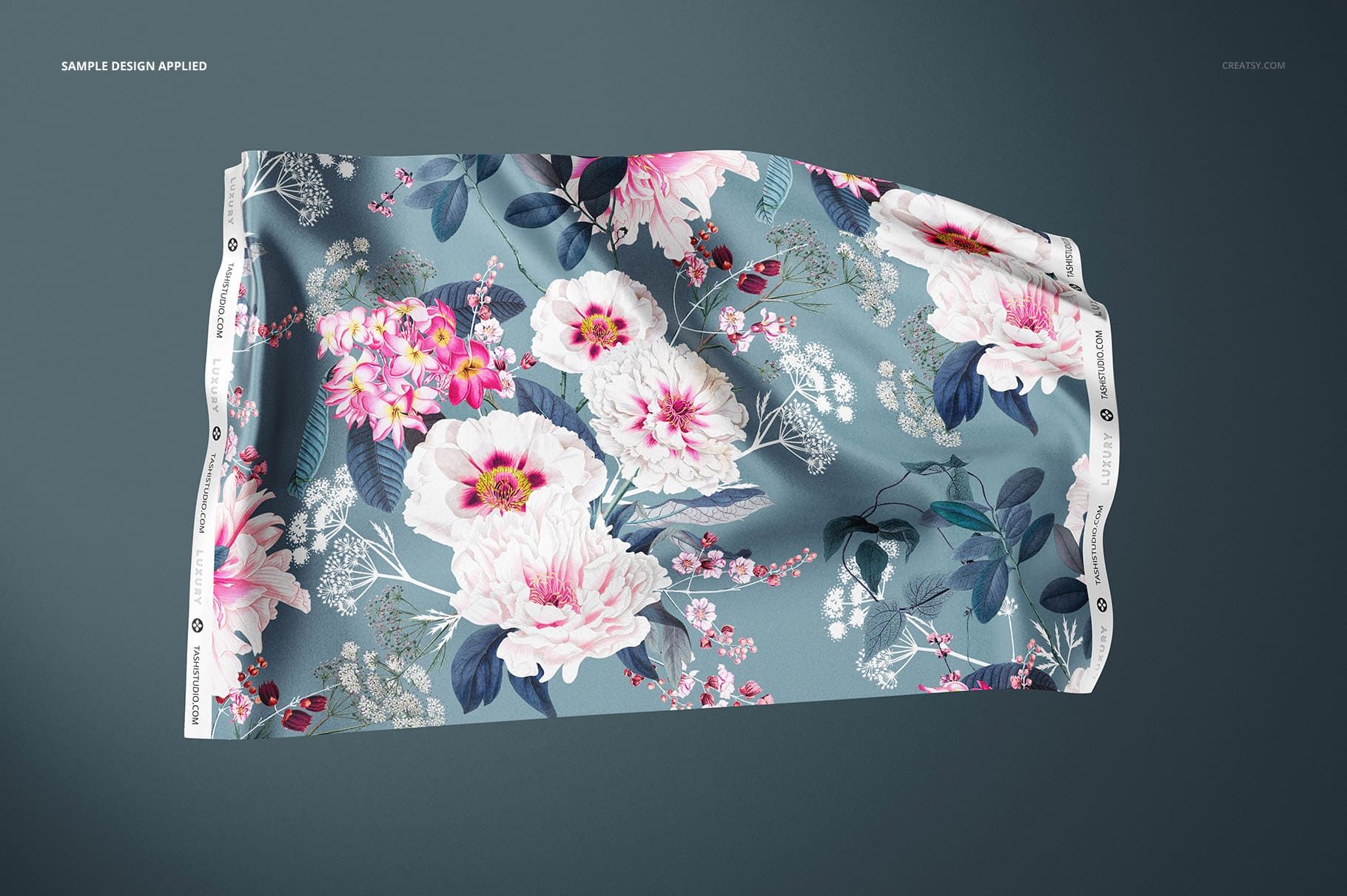 Silk swatch mockup featuring a botanical design with large white and pink flowers, shown from a top angle.