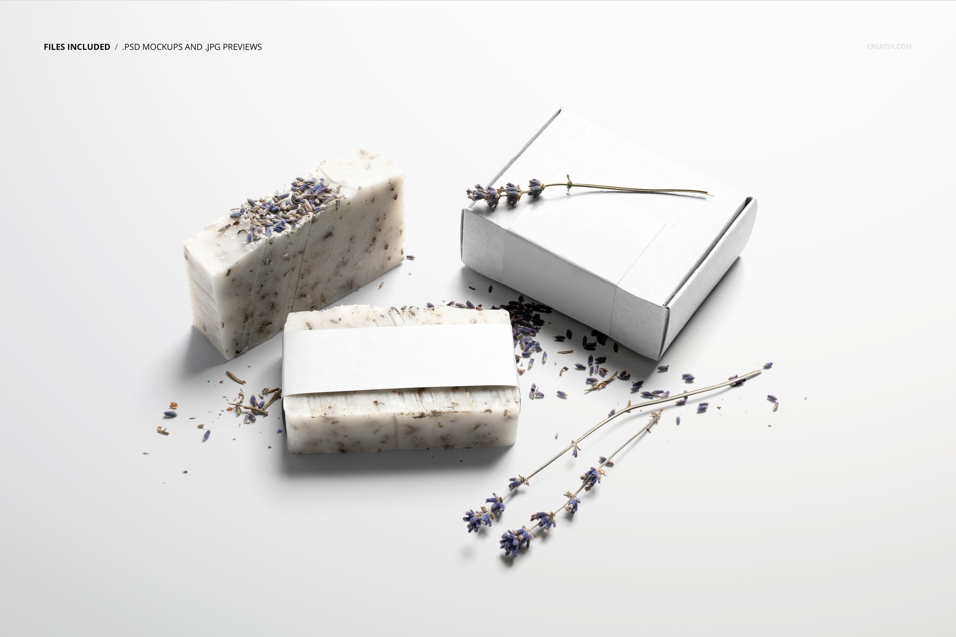 PSD mockup featuring handmade soap bars and packaging labels, displayed alongside a white box and lavender sprigs.