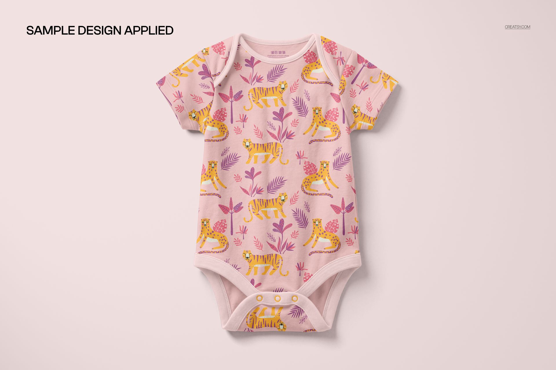 PSD mockup of a baby bodysuit featuring a colorful tiger and leaf print, shown from the front against a pale background.