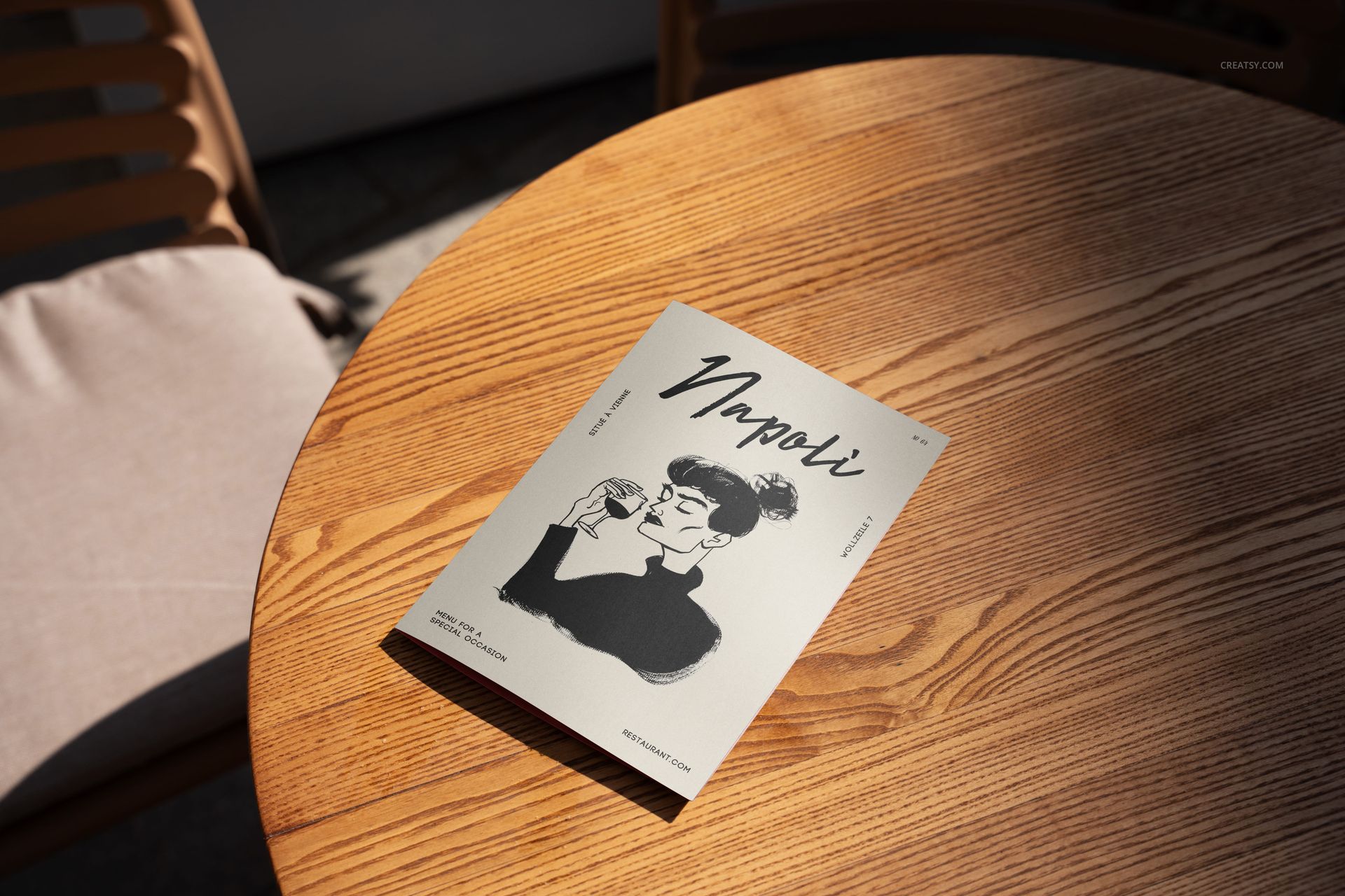 Outdoor restaurant menu mockup displayed on a round wooden table with sunlight and a chair in the background.