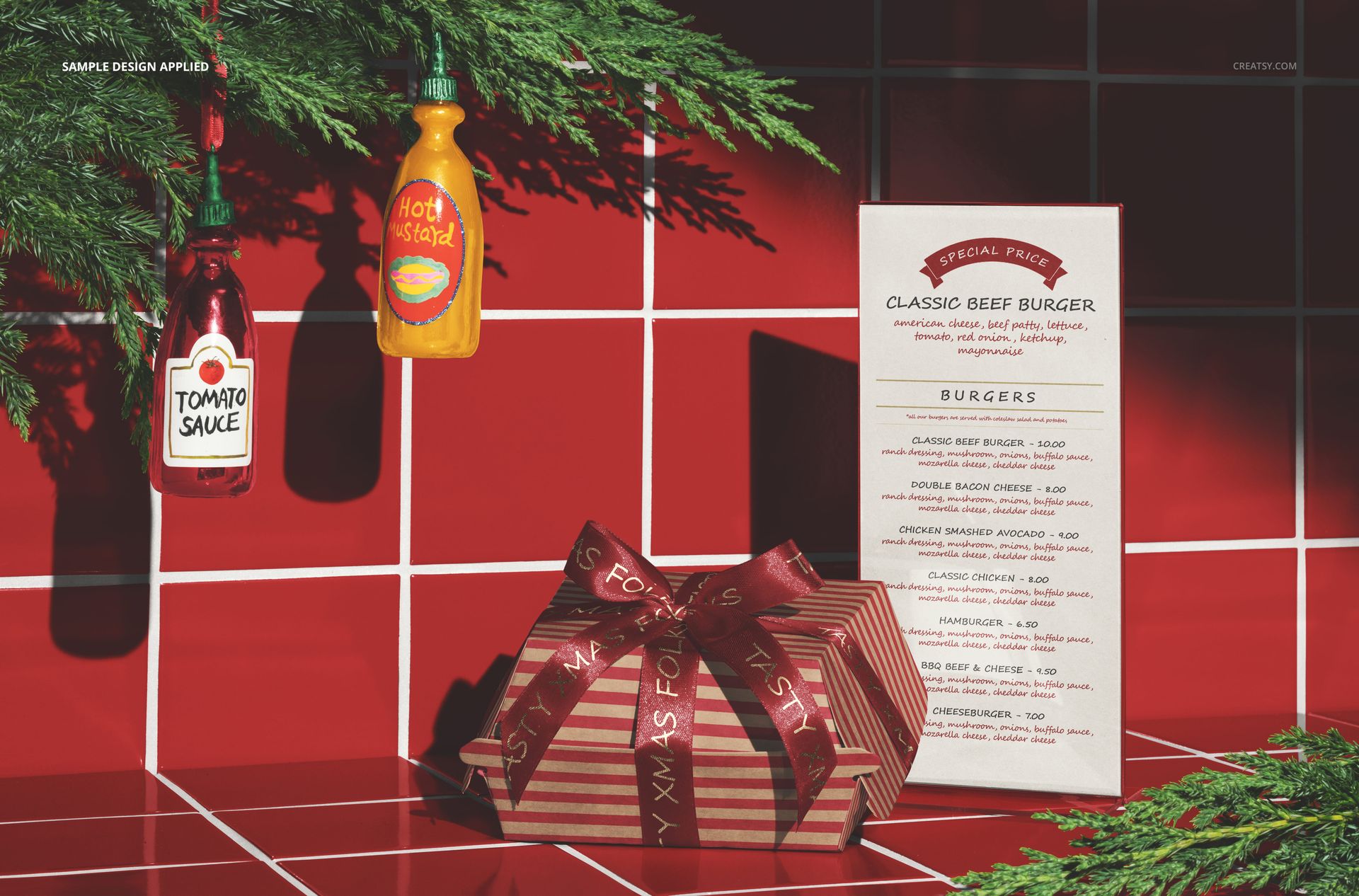 Christmas-themed fast food restaurant mockup featuring a wrapped gift box, menu card, and condiment bottles on a red tiled surface.