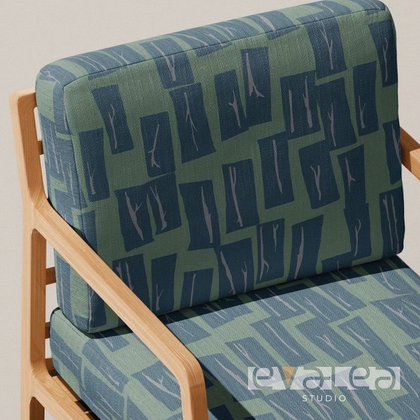Lounge chair mockup with light wood frame and cushions featuring a geometric blue and green pattern, viewed from above.
