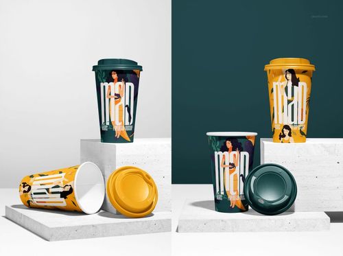Paper cup mockup featuring two upright cups and one lying down, with colorful lids and bold graphic designs on a stone platform.