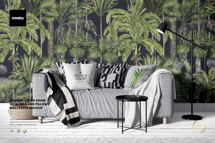 Modern living room with a gray sofa, patterned pillows, and tropical leaf wallpaper, front view mockup.