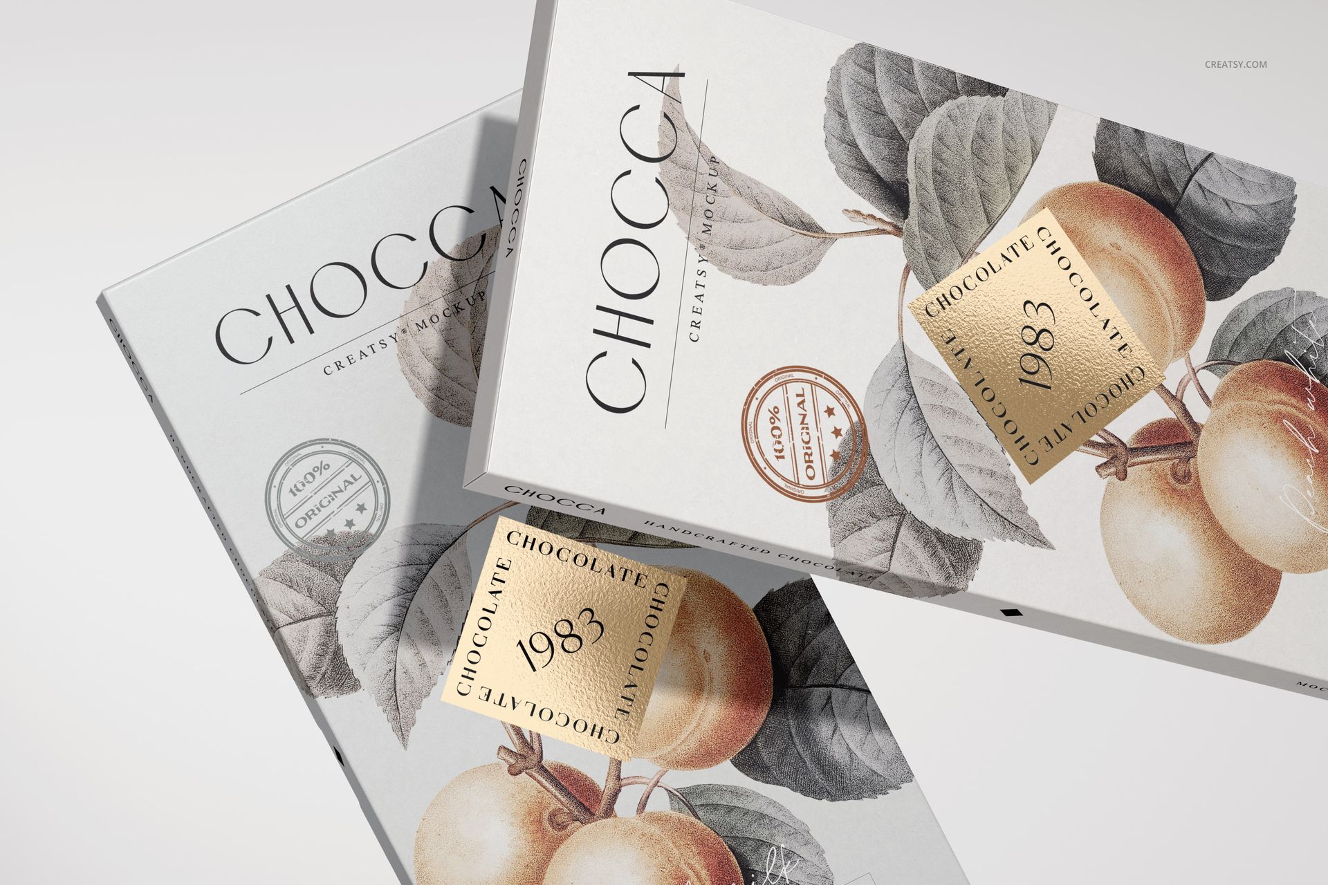Front view of two chocolate bar packaging mockups with botanical fruit illustrations and gold label accents.