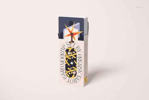 Tarot cards mockup featuring a standing box with colorful designs and several cards peeking out from the top.