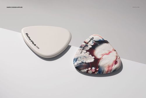 Guitar pick PSD mockup set with one pick in off-white and another with a swirling red, blue, and white artistic pattern.