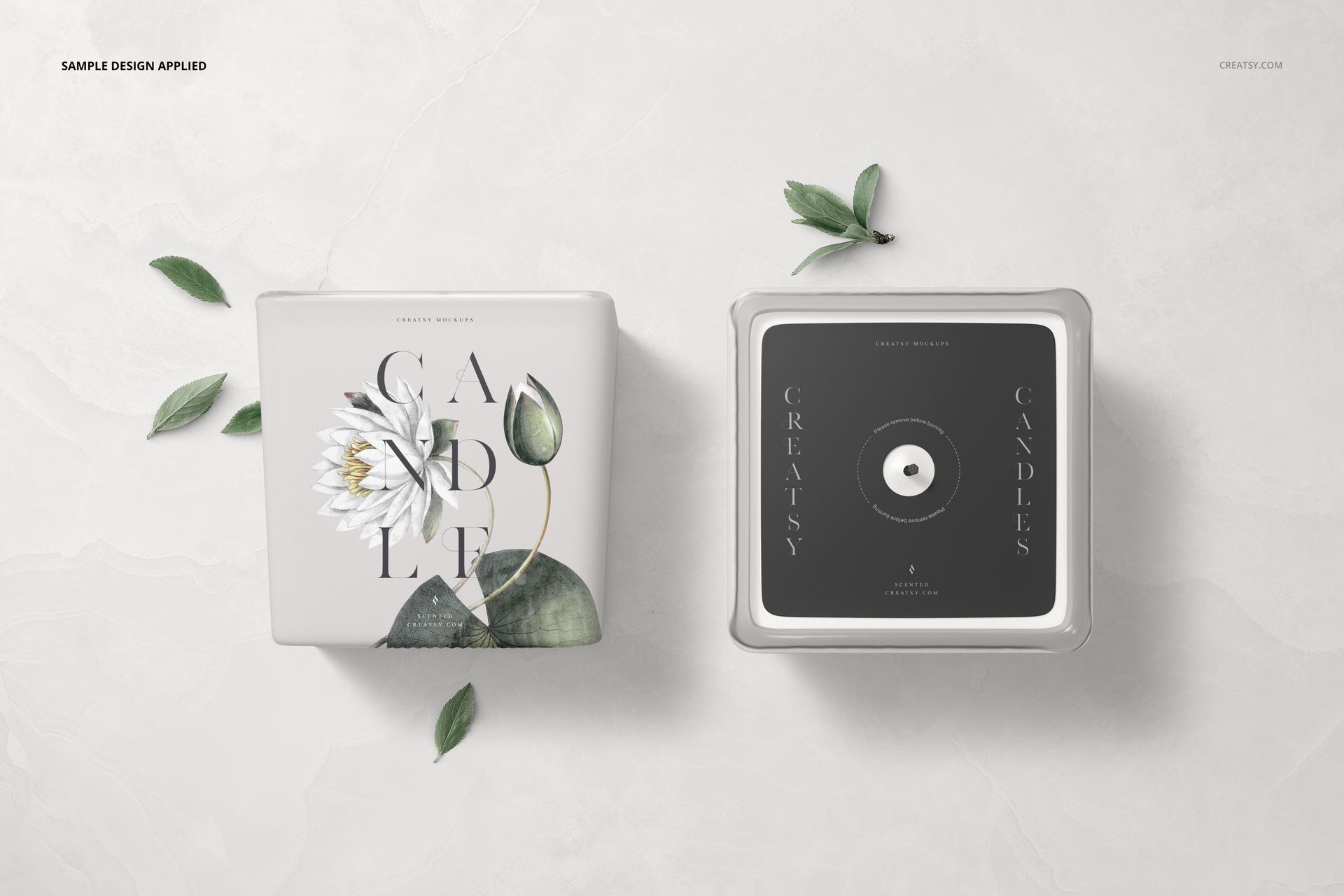 Square candle mockup featuring two candles with paper labels, viewed from front and top on a light marble surface.