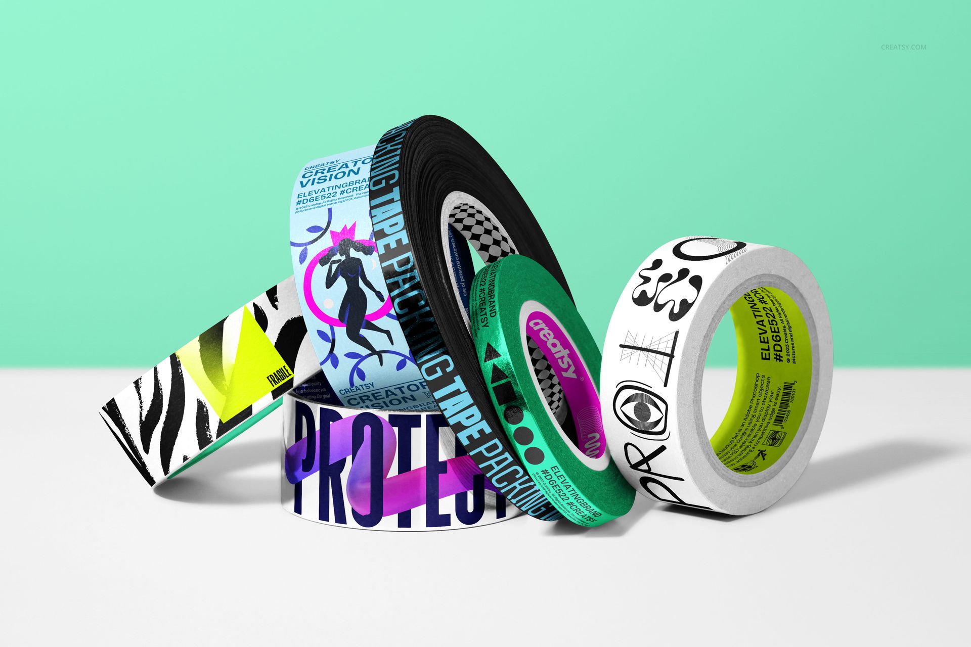 Packaging tape mockup bundle with various vibrant patterns and text, shown from a front angle on a solid surface.