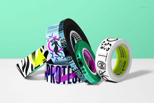 Packaging tape mockup bundle with various vibrant patterns and text, shown from a front angle on a solid surface.