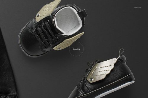 Kids' black sneakers featuring gold wing accents, presented in a PSD mockup, viewed from a top perspective.