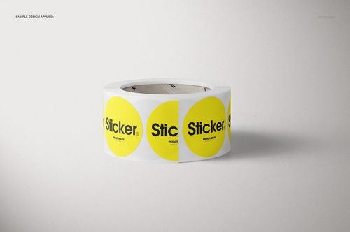 Mockup of a packaging roll with round yellow stickers and black text, presented in a simple, well-lit scene.