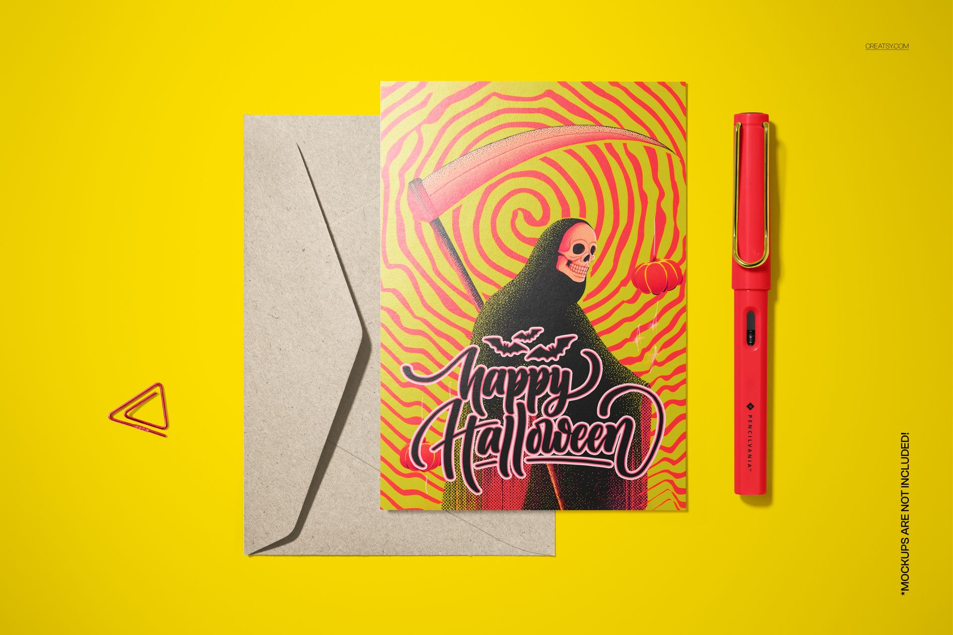 Halloween card mockup with a skeleton death figure, psychedelic red and yellow pattern, and matching envelope on yellow surface.