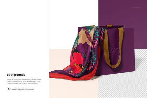 Colorful habotai silk scarf with bold floral pattern draped over a purple paper bag, front view mockup scene.